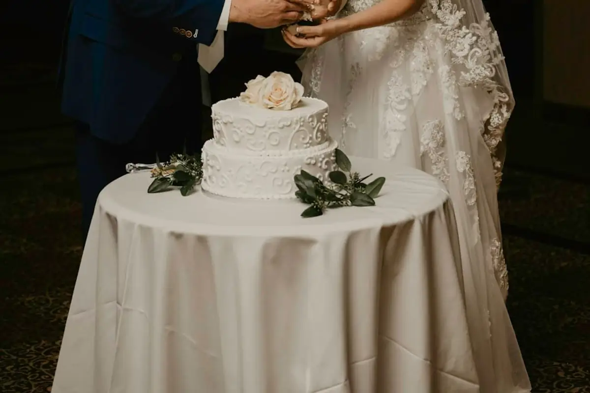 A couple cutting their wedding cake