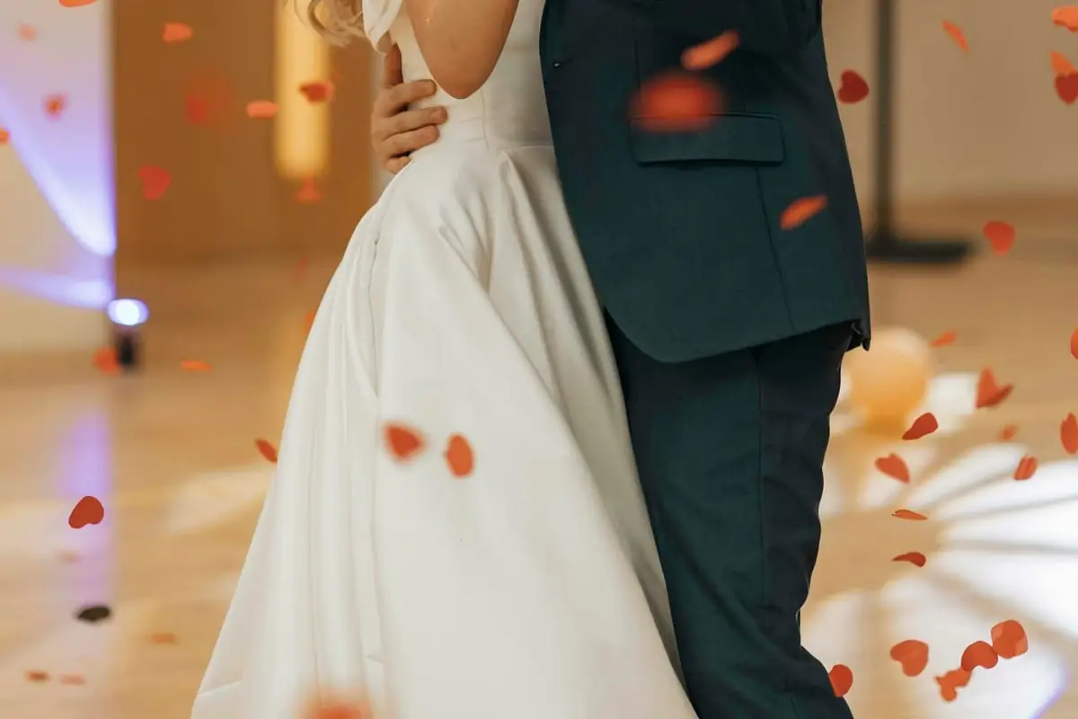 A bride and groom posing for a photo