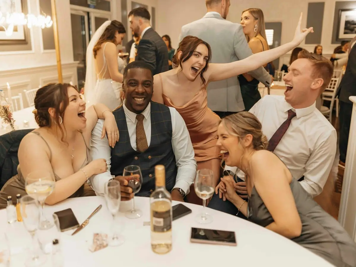 Guests sitting around a reception table